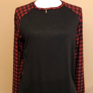 Black tee with Buffalo Plaid sleeves. NWOT